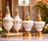 Luxury black and gold decorative jars and finials displayed on an elegant marble table with premium interior décor setup