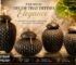 Premium decorative ceramic vases with elegant ribbed texture and gold handles displayed in coral, black, brown, and white colors for luxury home and event décor.